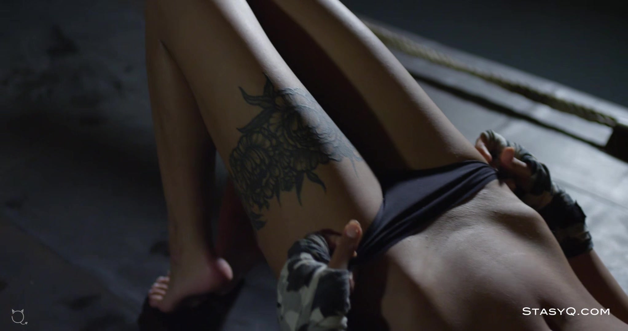 Busty tattooed babe stripping and teasing with her freshly shaved pussy