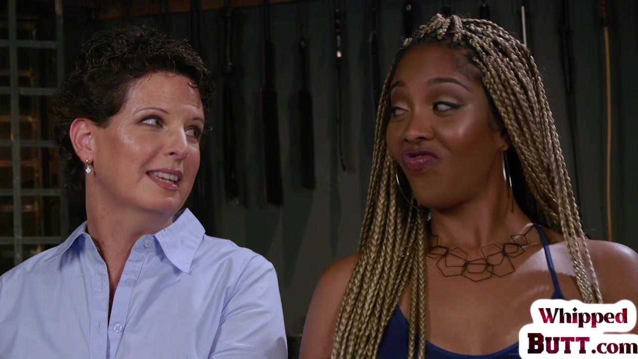 Whipping ebony dyke punishes trapped lesbian with toys
