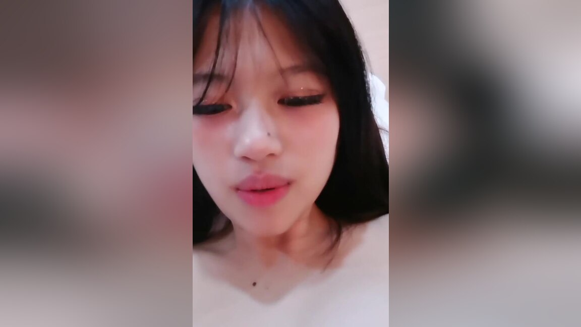Thin Asian dude films himself fucking his stunning girlfriend while she's undressed.