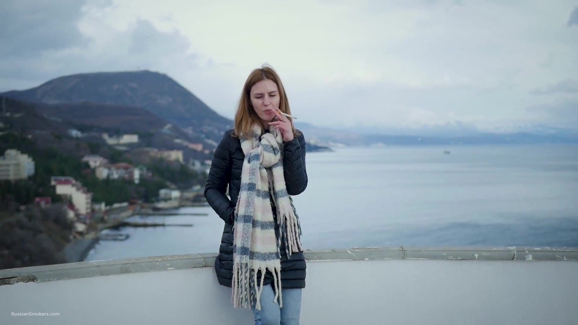 Beautiful Lady Is Smoking Two Saratoga Cigarettes In A Row On A Beautiful View
