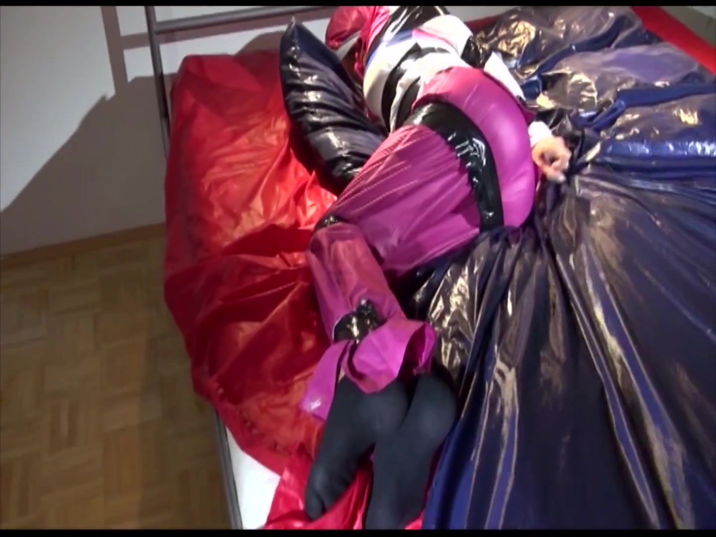 Watch 2 Videos With Lucy Tied And Gagged In Shiny Nylon Rainwear And A Windbreaker From Our Archives 2013