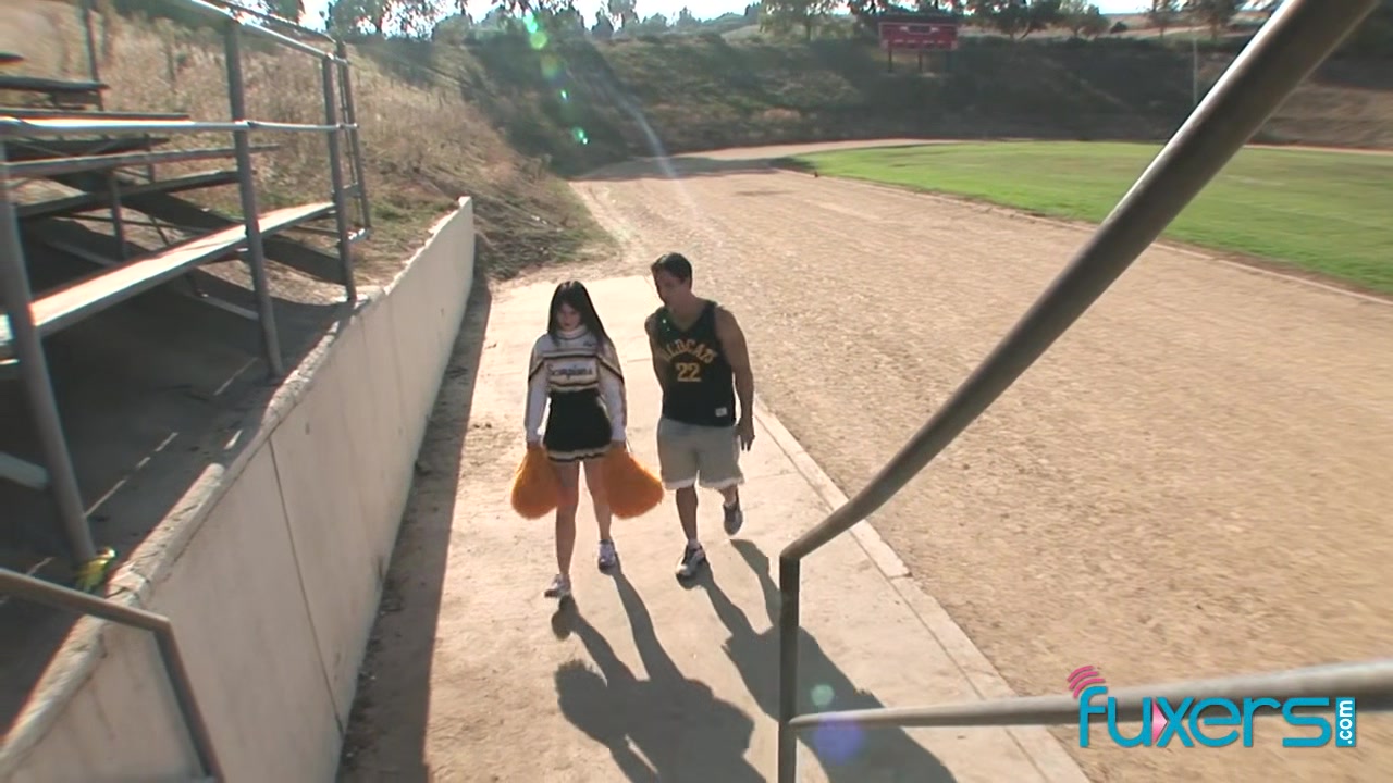 Cheerleader with older coach