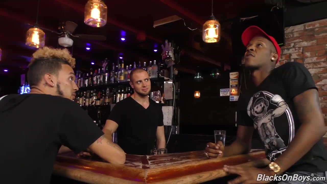 Black guys sharing the bartender at a pub