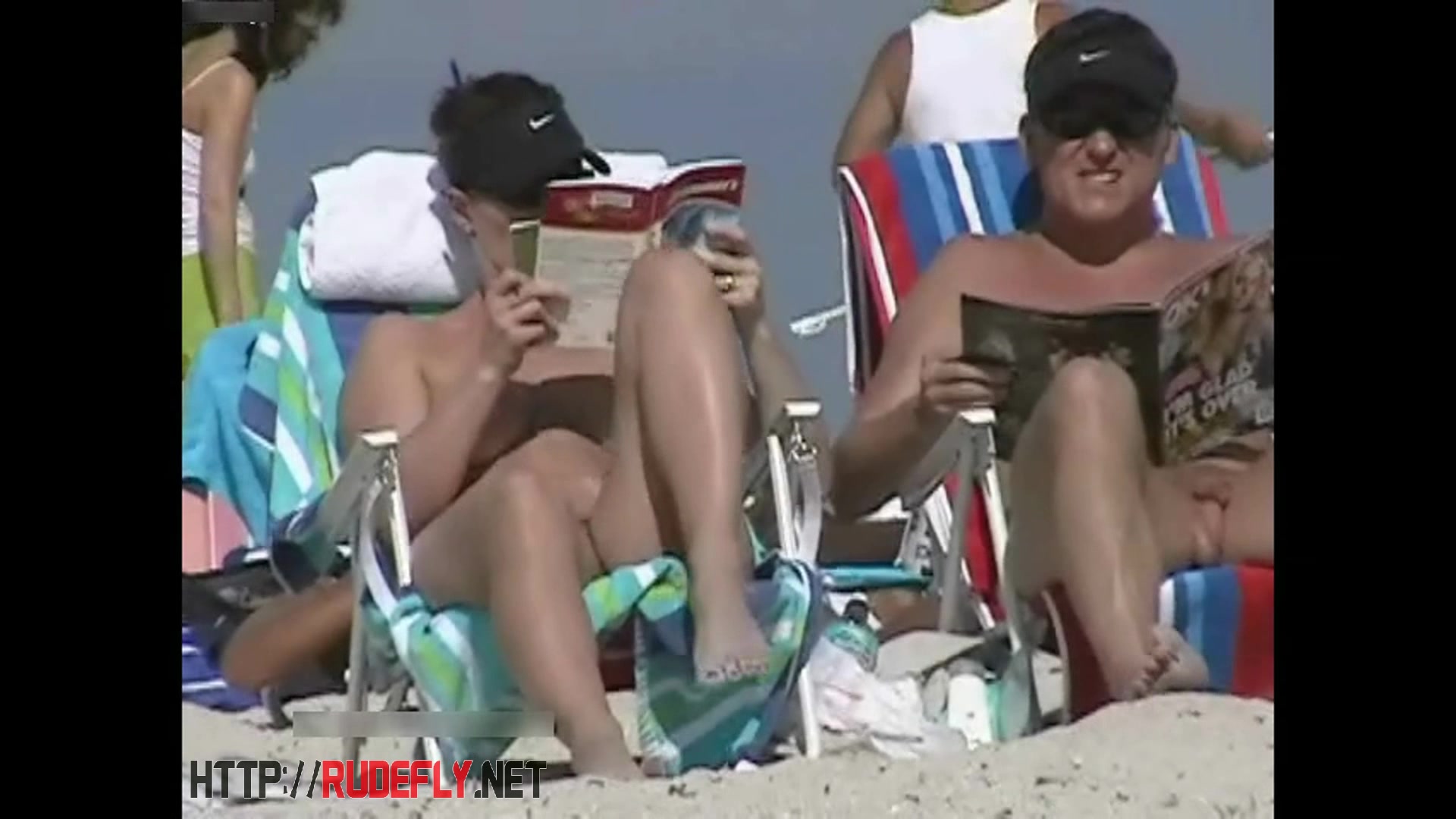 Couple split by Strangers on a nude beach