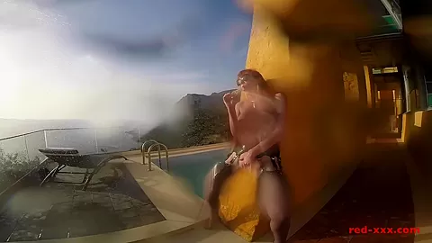Sexy mature Red XXX masturbates outside by the pool