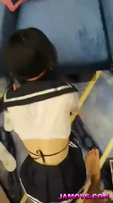 A young Chinese woman and her boyfriend watch