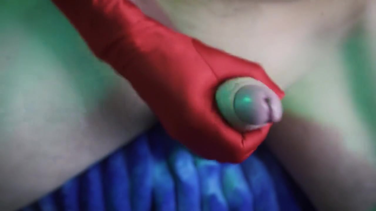 A Man Masturbates His Penis On A Chair Wearing Red And White Gloves