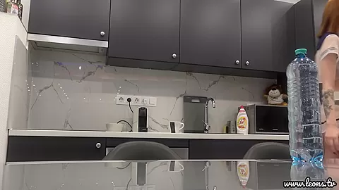 Sexy And Horny Girl With Socks In The Kitchen Prepares A Coffee For Herself Flashing Her Boobs