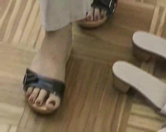 Lovely woman trys on different shoes in the foot fetish vid