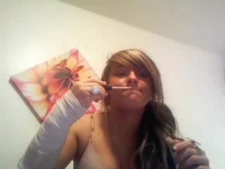 Glamorous bitch makes duck lips and rubs her twat