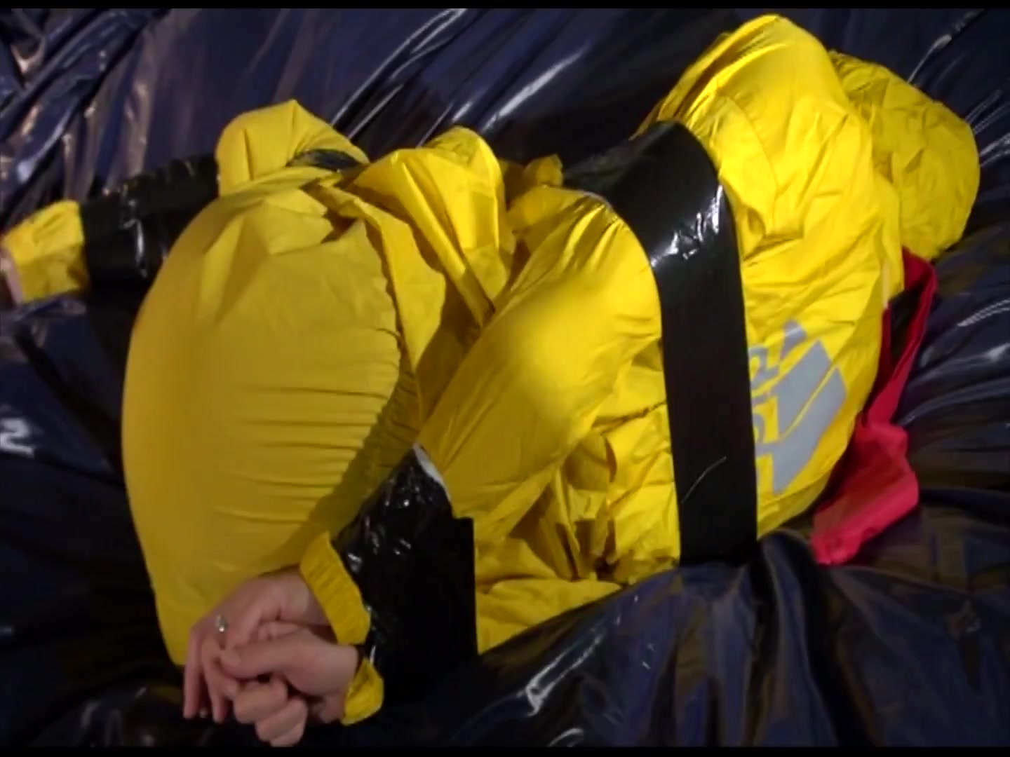 Get 2 Archivevideos With Sonja Enjoying Bondage In Her Shiny Nylon Rainwear