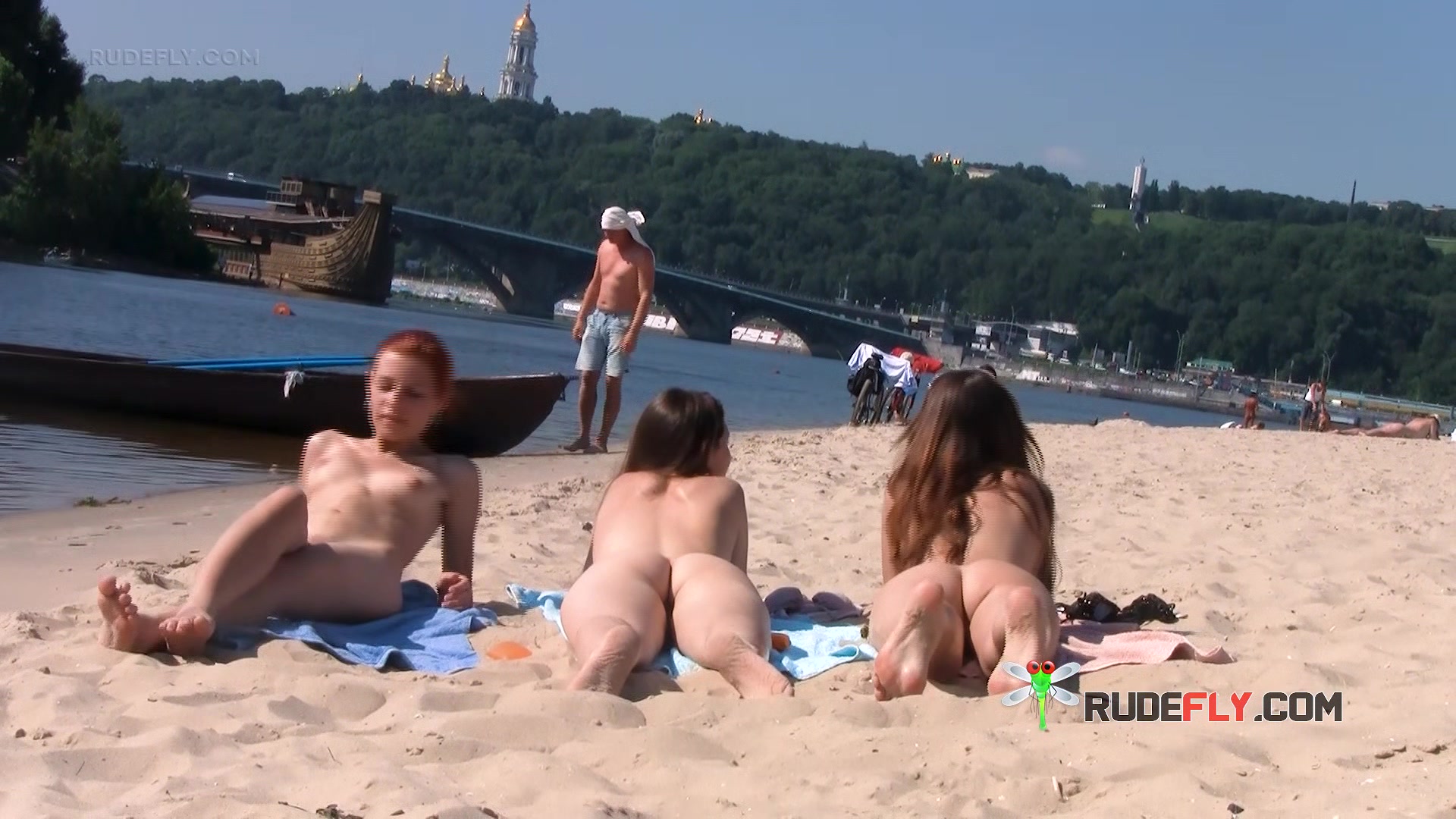 Wicked young nudist enjoys being topless at the beach