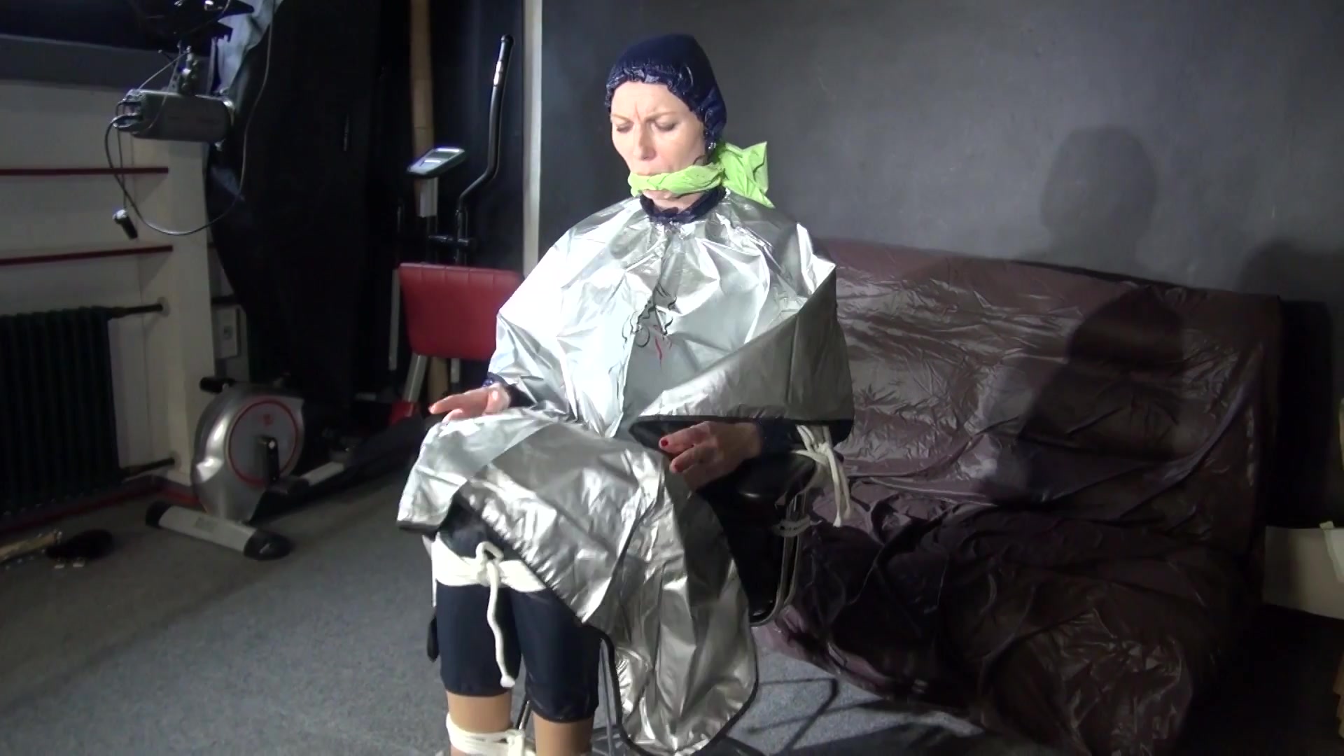 See Ronja Tied And Gagged On A Barber Chair In Shiny Nylon Rainwear And A Shiny Cape!