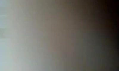 Asian slut films her naked boobies in the mirror