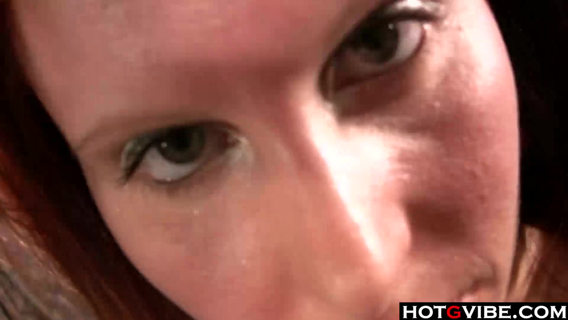 Big Boobed Redhead fingers her pussy
