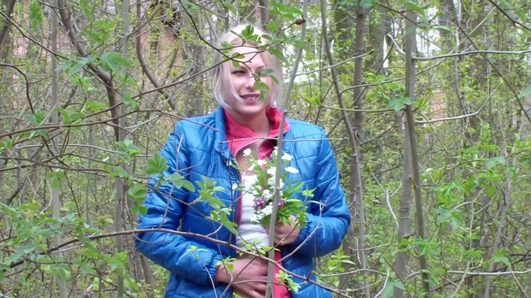 Adult pair making love on the blossoming meadow