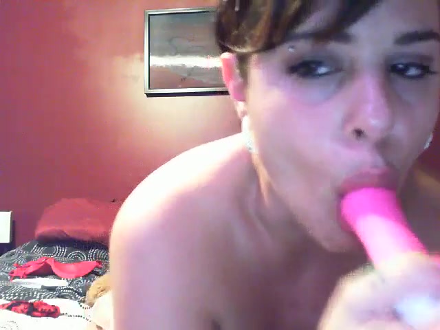 Short-haired Latina pleasing her pink hole with a toy