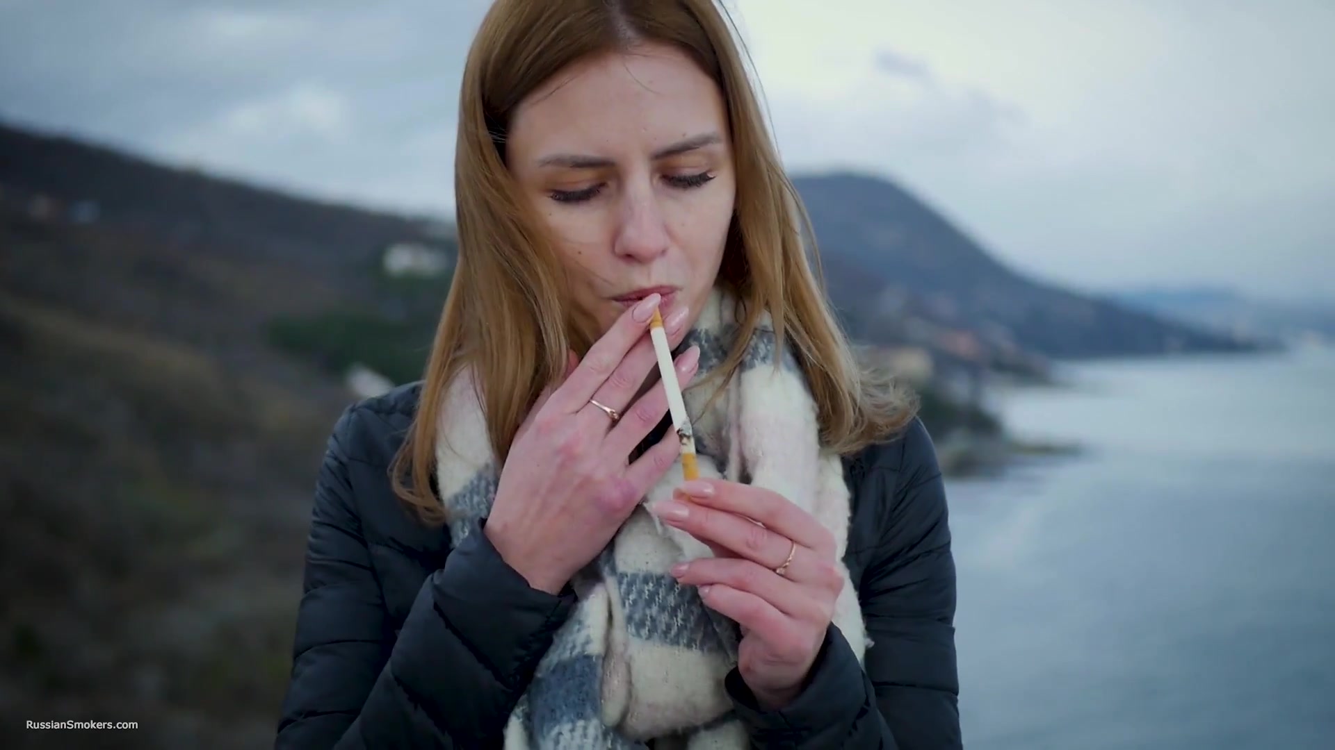 Beautiful Lady Is Smoking Two Saratoga Cigarettes In A Row On A Beautiful View