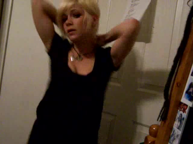 Short-haired blonde girl dances in the homemade video