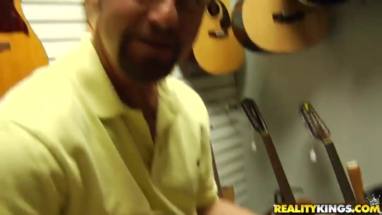 Dark haired chick is fucked in a musical shop