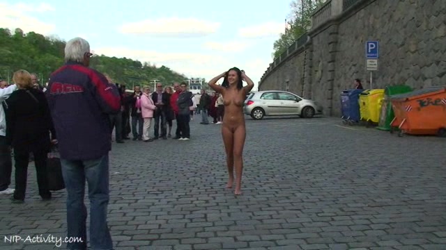 Delicious naked babe Angelica walks through the streets