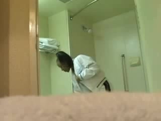 Darksome chick touching her snatch in the bathroom