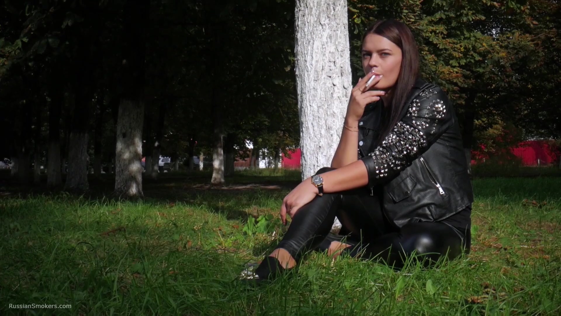 Pretty Faced Asya Is Smoking A Cigarette Outdoors