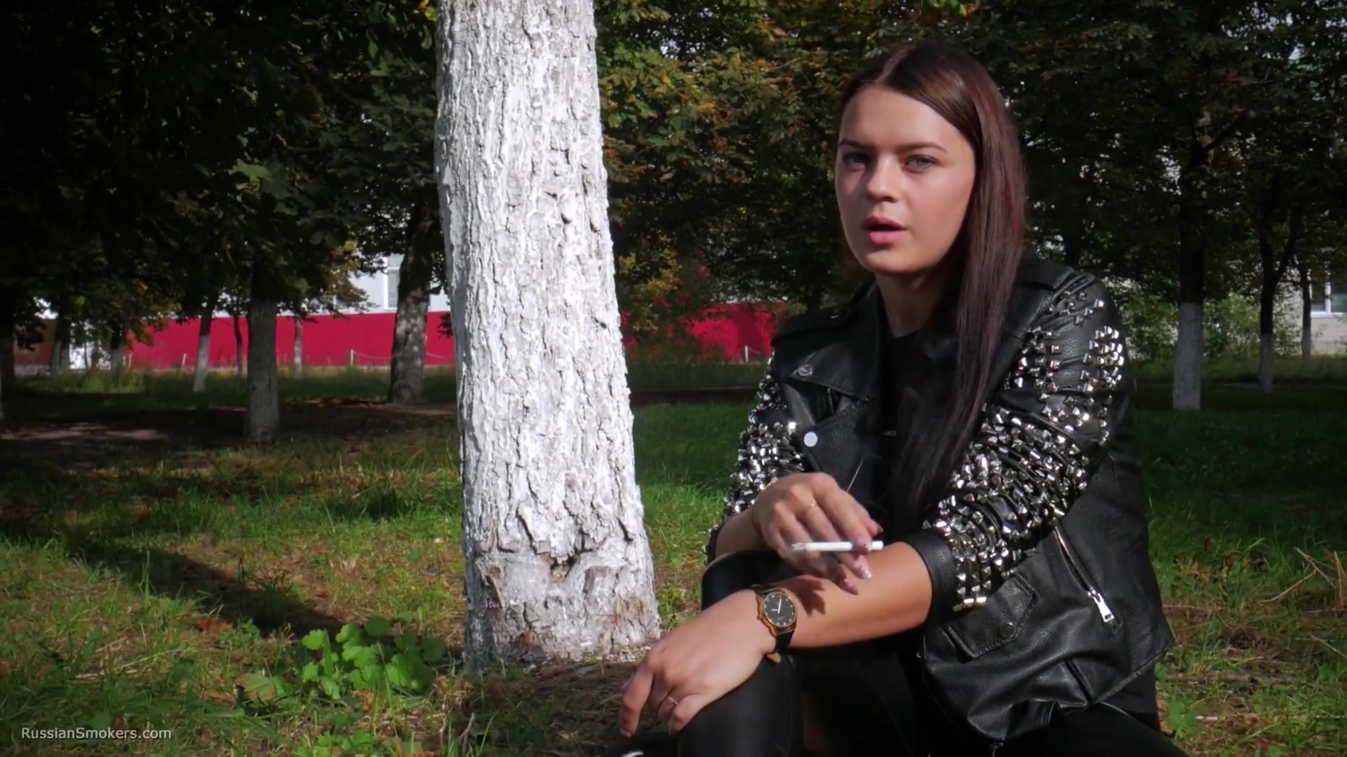 Pretty Faced Asya Is Smoking A Cigarette Outdoors