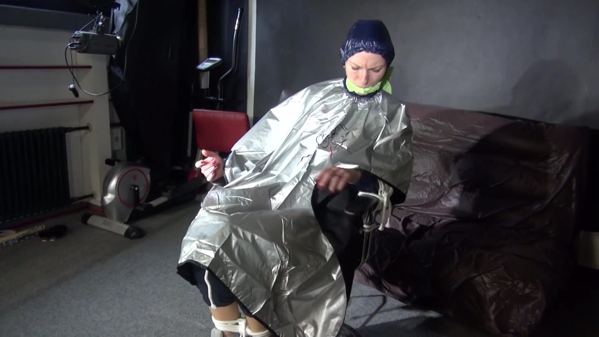 See Ronja Tied And Gagged On A Barber Chair In Shiny Nylon Rainwear And A Shiny Cape!