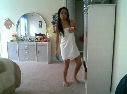 Petite and sexy Japanese babe puts on clothes on the webcam
