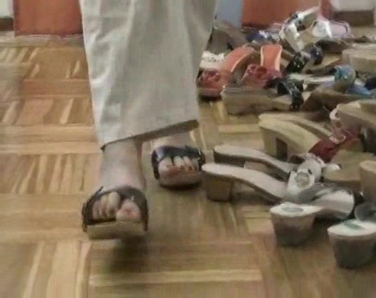 Lovely woman trys on different shoes in the foot fetish vid