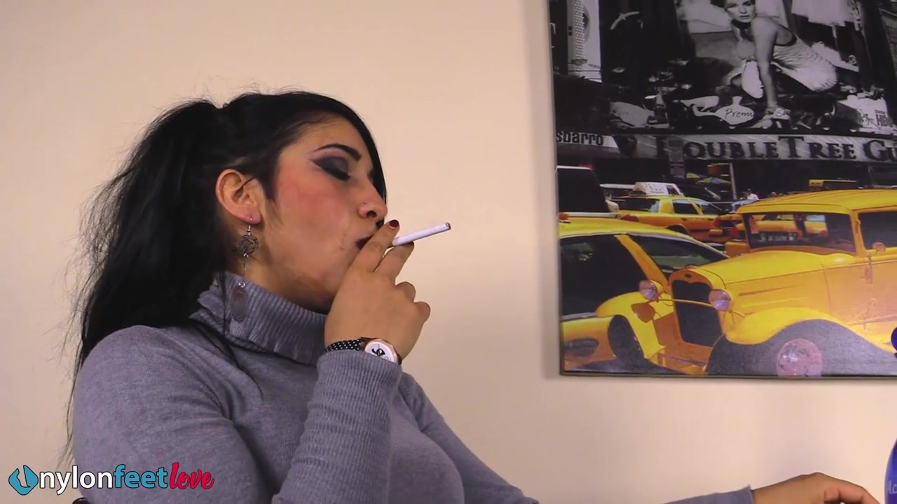 Gorgeous Sharon smoking a cigarette and showing off her nyloned feet