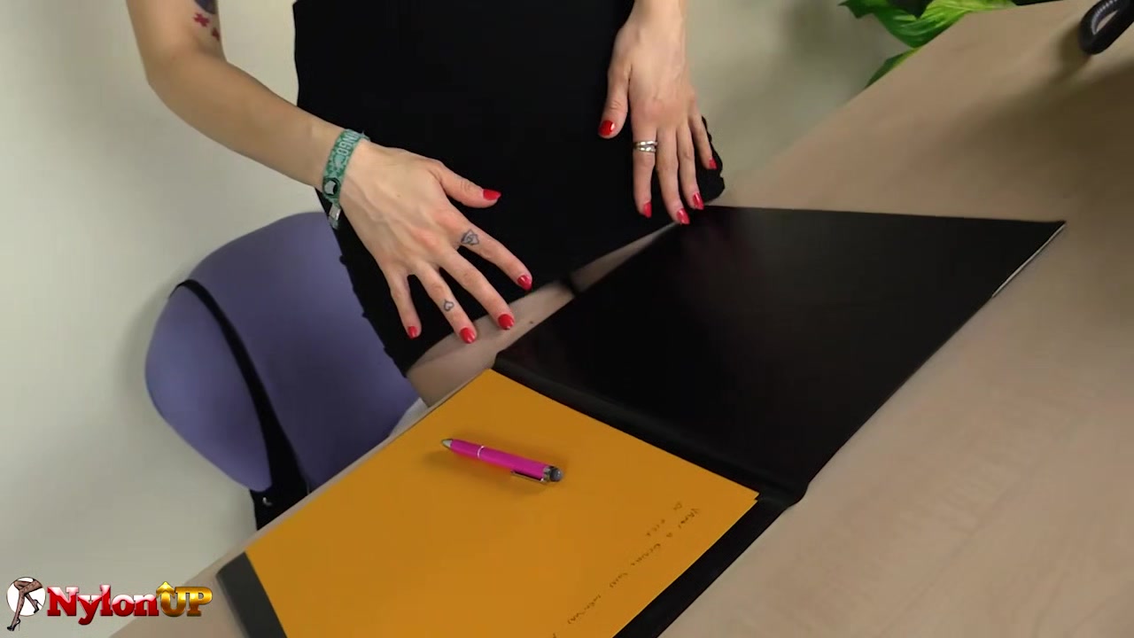 Redhead wearing sheer nylons masturbates in the office