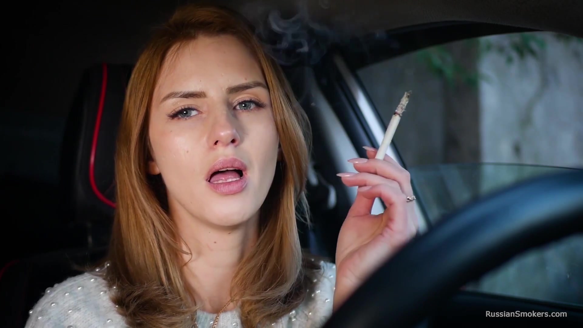 Meet Anastasia In Her Car While She Is Smoking Two 120mm All White Cigarettes