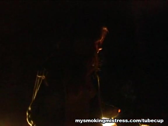 Smoking Mistress Sits on Slave