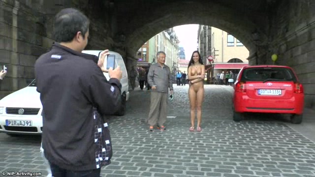 Long haired brunette walks naked in public in hd movie