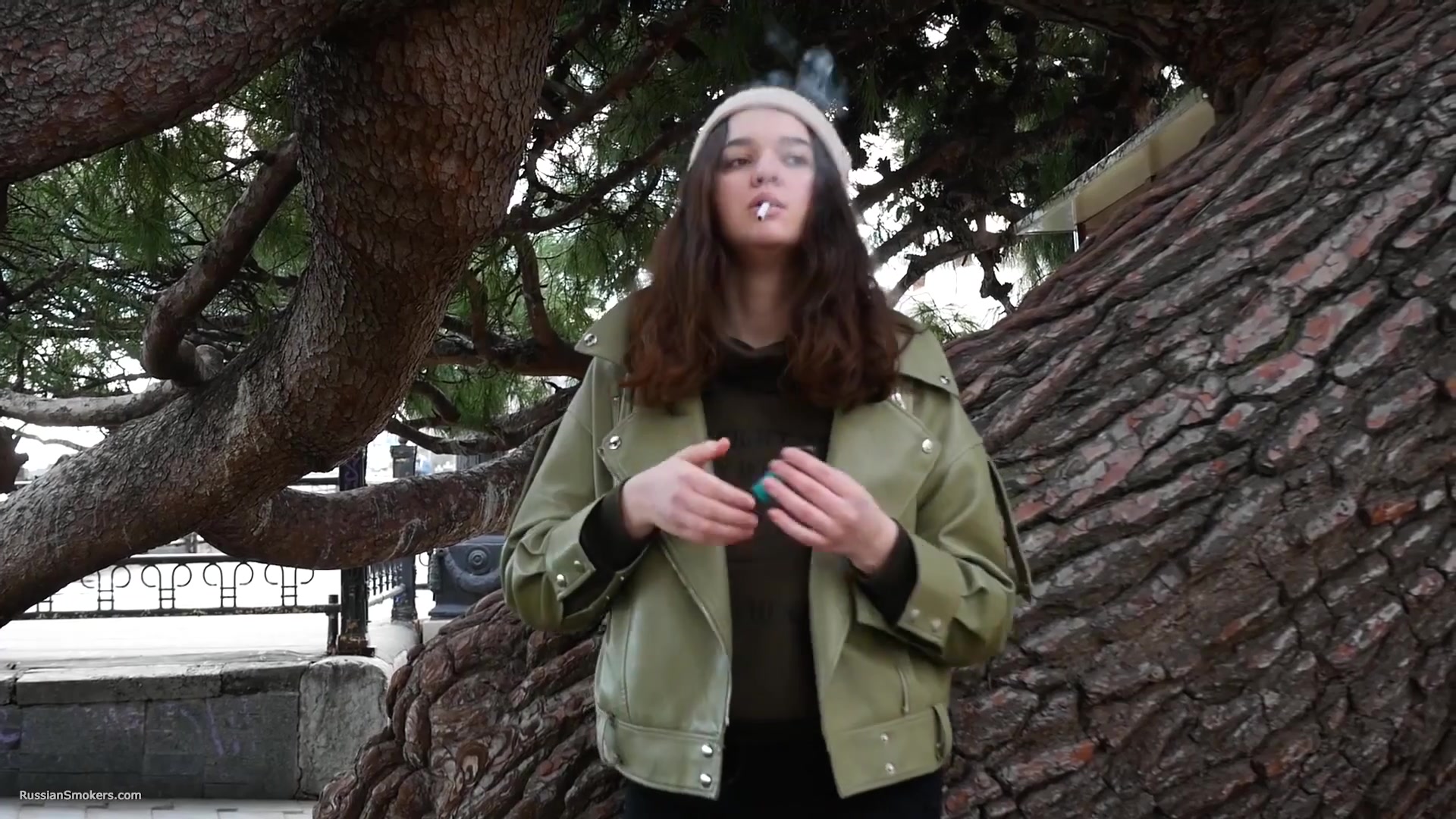 Young Brunette Is Taking An Unhurried Stroll With Allwhite 120mm Cigarette
