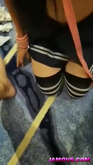 A young Chinese woman and her boyfriend watch