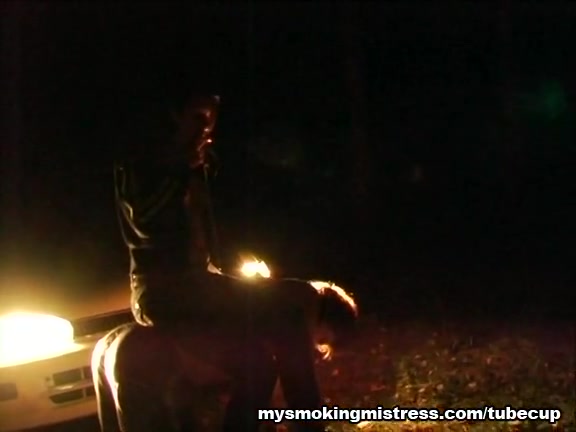Smoking Mistress Sits on Slave