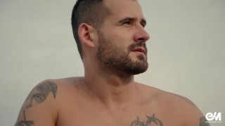 Full body tattoo man on bicycle strips and shows his uncut foreskin cock