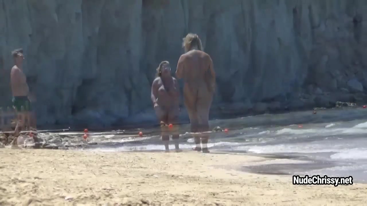 Nude Chrissy is posing in the sea and walking along-shore