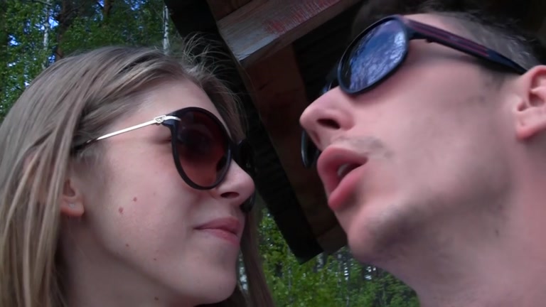 Youthful pair walking in the woods drilled