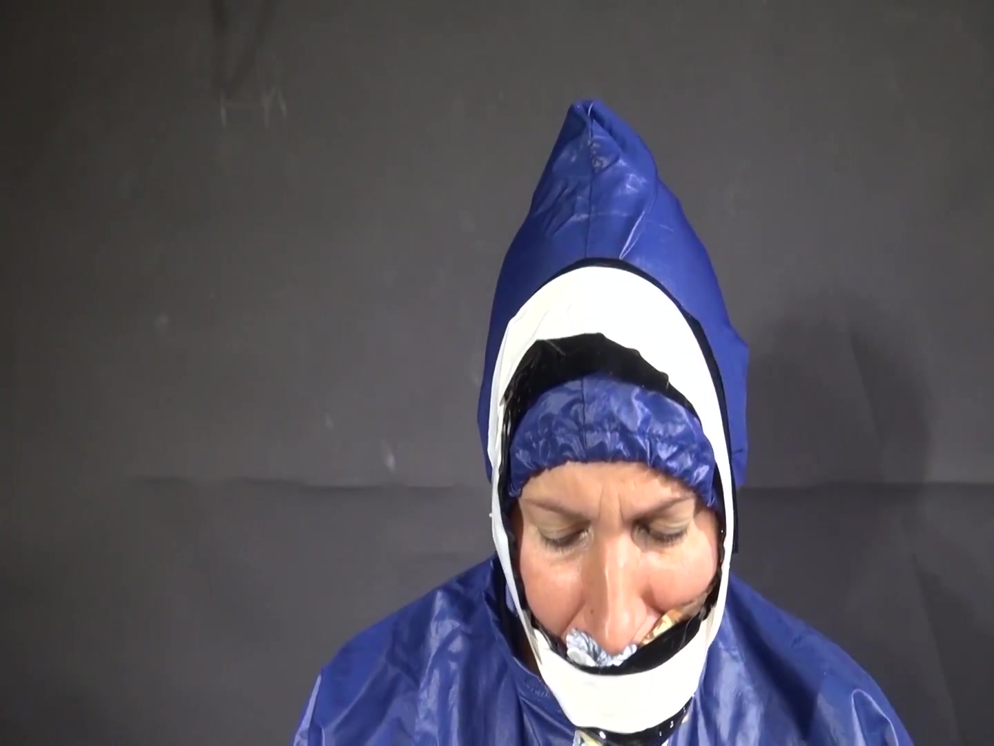 Watch Sandra Beeing Bound, Pantygagged And Finally Pantyhooded In Her Shiny Nylon Rainwear