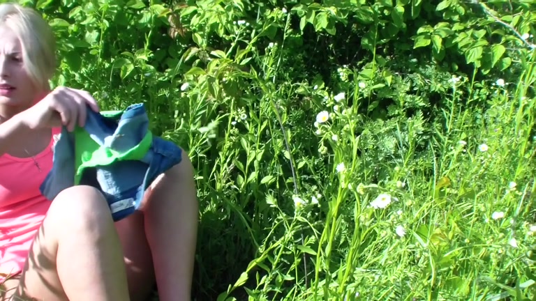 A blossoming meadow and undressed pair fucking in the centre