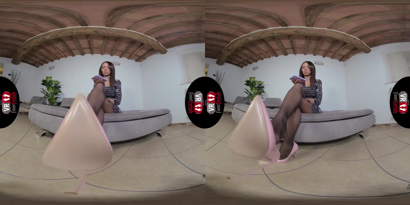Stunningly Beautiful Daniela Lets Her Pink Stilettos Dangle Off Her Feet - VRFootFetish