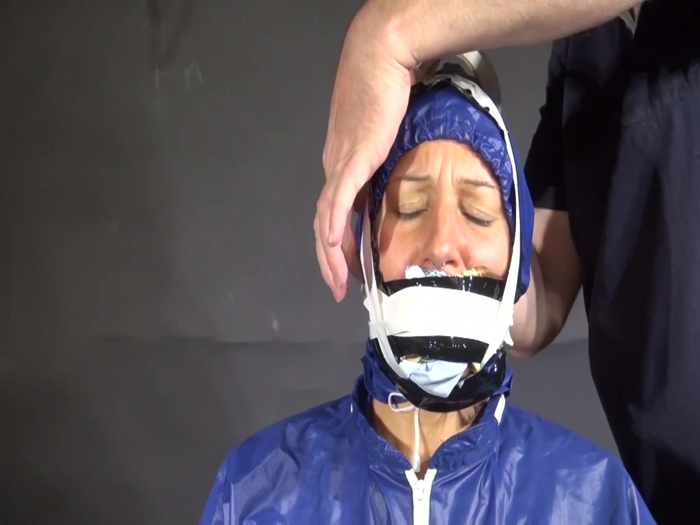 Watch Sandra Beeing Bound, Pantygagged And Finally Pantyhooded In Her Shiny Nylon Rainwear