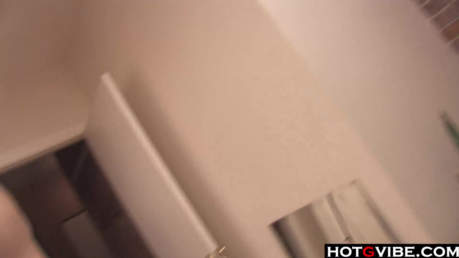 Slim brunette warms her pussy up