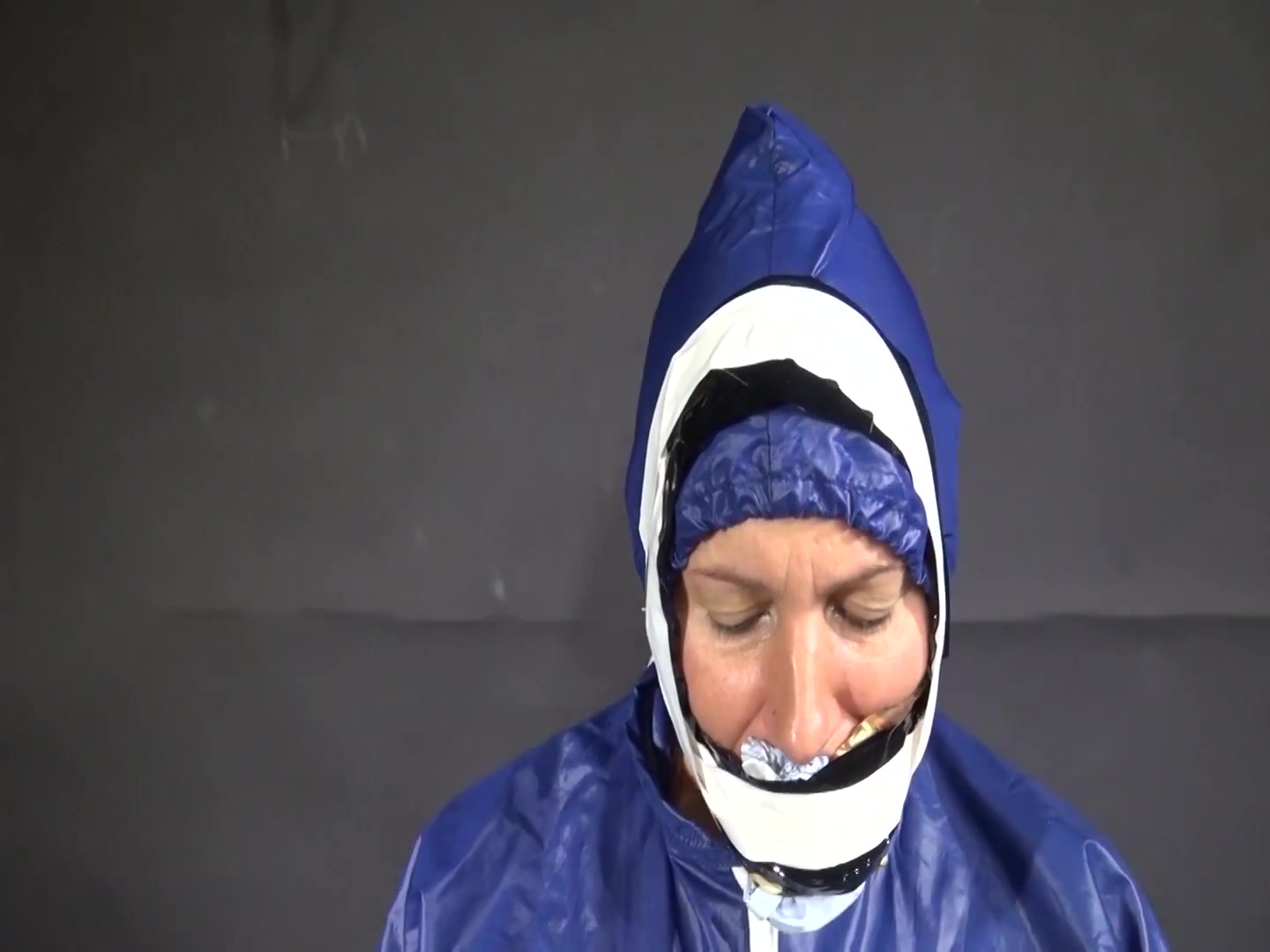 Watch Sandra Beeing Bound, Pantygagged And Finally Pantyhooded In Her Shiny Nylon Rainwear