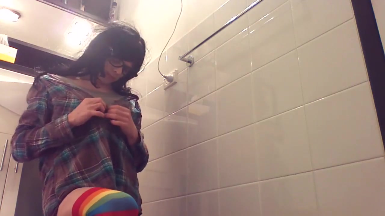 nerdy hipster transgirl covering herself in lube