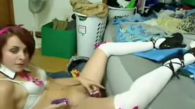 Cute girl spreading her legs and stuffs her pussy with a sex toy